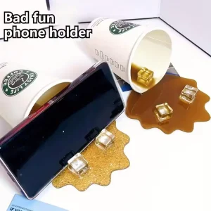 【Beautiful】1pc Overturned Coffee CupPrank Phone Stand, Plastic Prank Toy, A Must-have For Lazy People, Home Decoration Ornament.